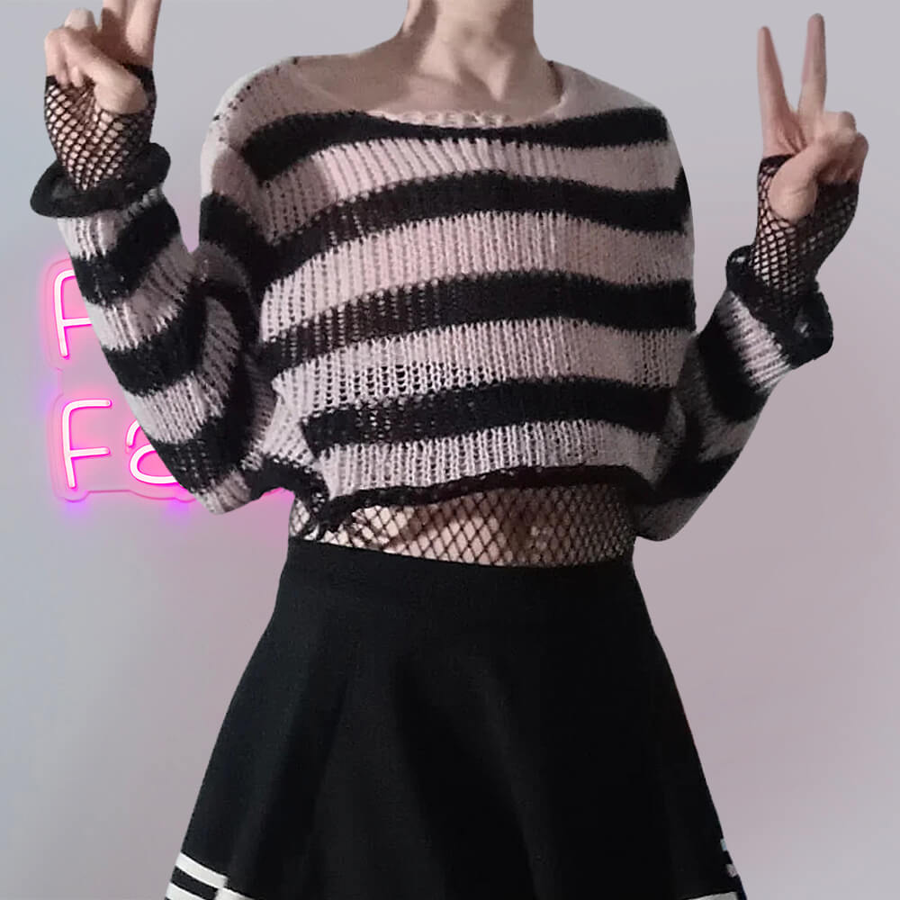 Femboy in pink and black striped distressed crop sweater with black striped skirt