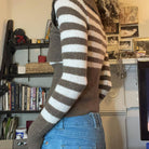 Femboy in ribbed knit asymmetric button pullover