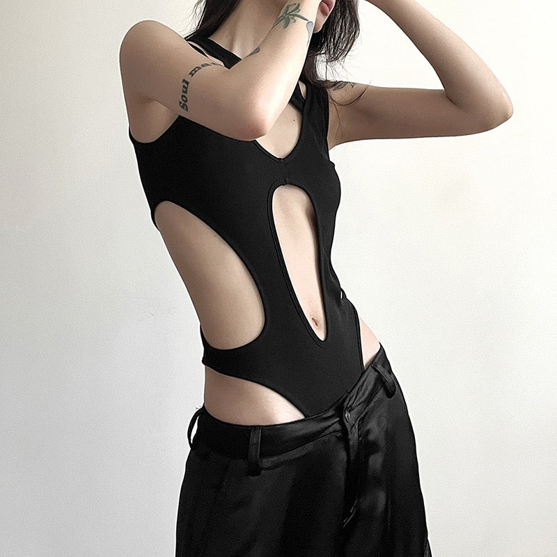 Person wearing a black sexy black hollow out sleeveless bodysuit