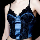 Black lace camisole with a blue satin center on a black background