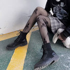 Femboy in sweet gothic skull fishnet pantyhose