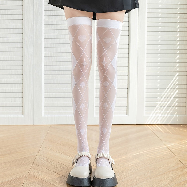 femboy in white poker print thigh high stockings