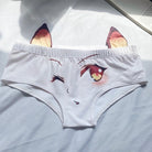 White underwear with fox ears and face design on a light blue surface