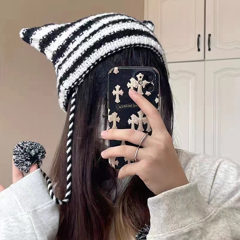 Femboy wear a black and white cute femboy cat hat