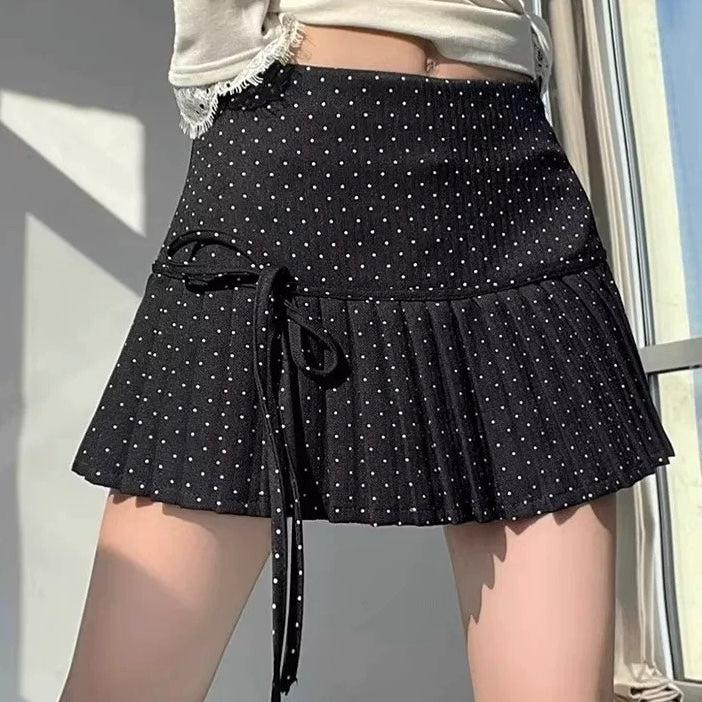 Femboy in black polka dot pleated skirt