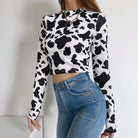 Femboy wear a cow print long sleeve crop top