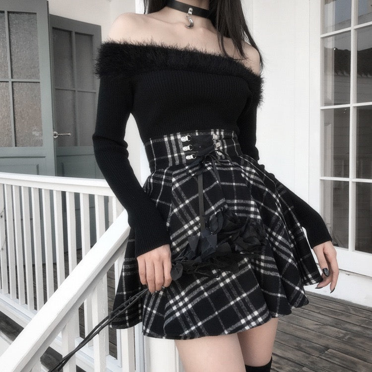 Femboy wear a high waisted black and white plaid skirt and black top