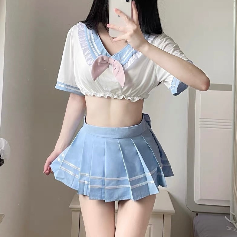 Person wearing a pastel blue cute school girl lingerie with ruffled details.