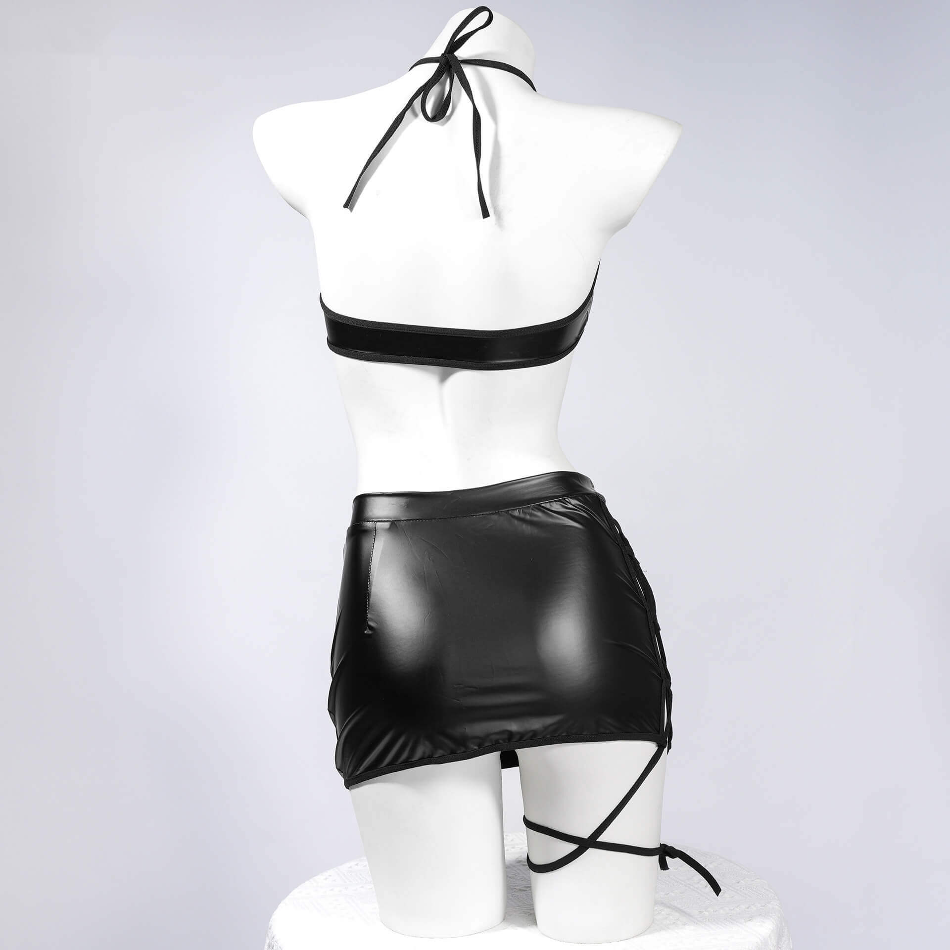 Femboy wear black cutout halter top and skirt lingerie set back