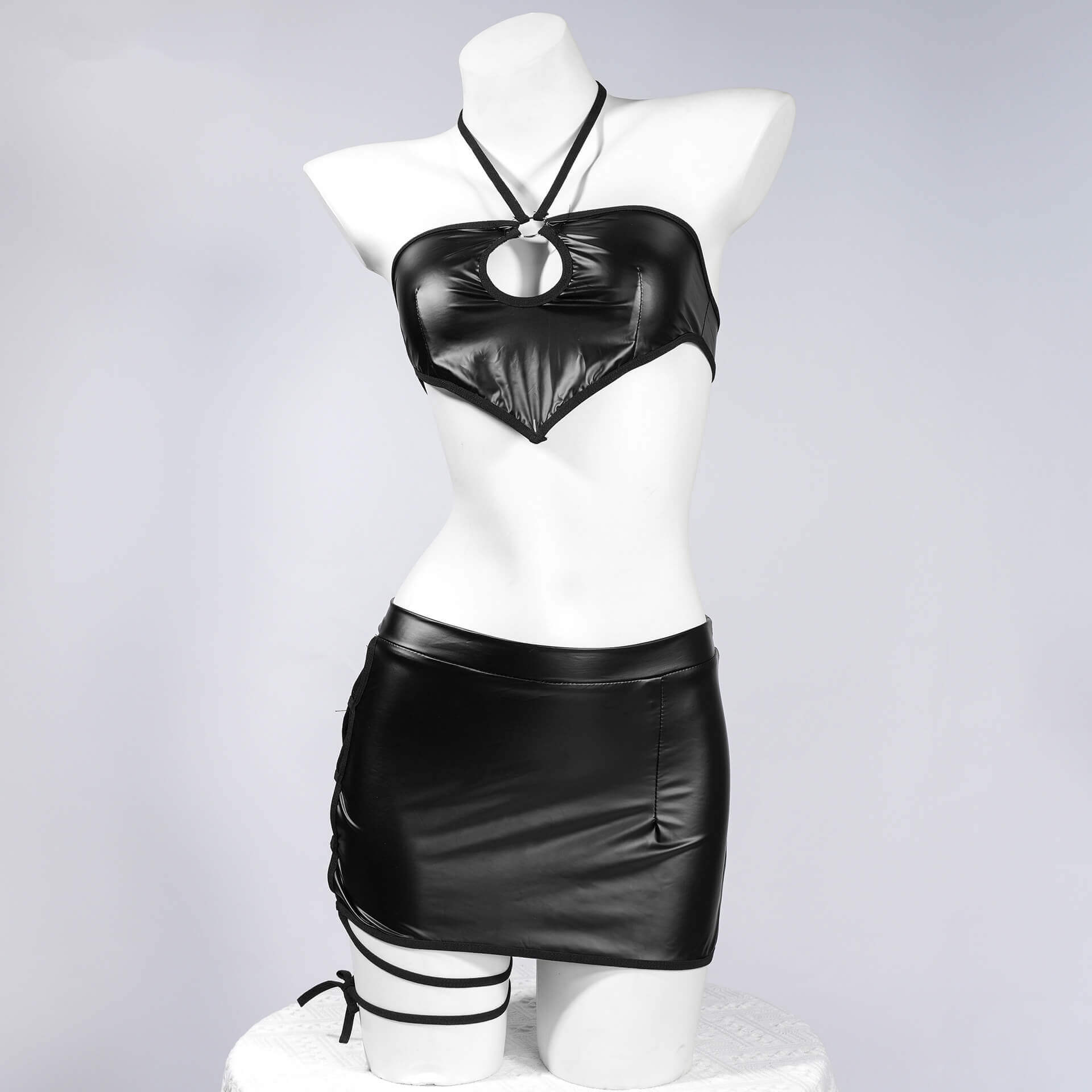 Femboy wear black cutout halter top and skirt lingerie set front