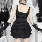 Femboy in black gothic cross camisole top back