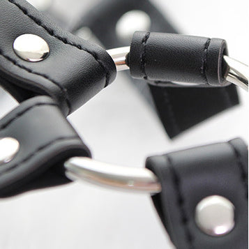 Femboy wear black leather body harness and nipple clamps detail