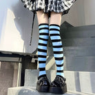 Femboy in Blue And Black Striped Thigh High Socks