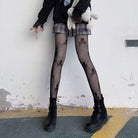 Femboy wear gothic skull fishnet pantyhose front