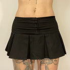 Femboy wear low waisted black mini skirt front