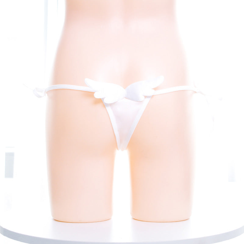 Femboy wear white side tie thong panty with wings