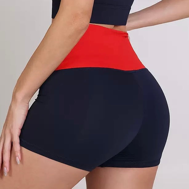 Femboy wearing a black and red two-tone skirt on a plain background