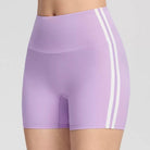 Black and red athletic femboy yoga shorts on a plain background