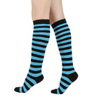 Black and blue femboy pin striped knee-high socks on a white background