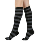 Black and gray femboy striped knee-high socks on a white background
