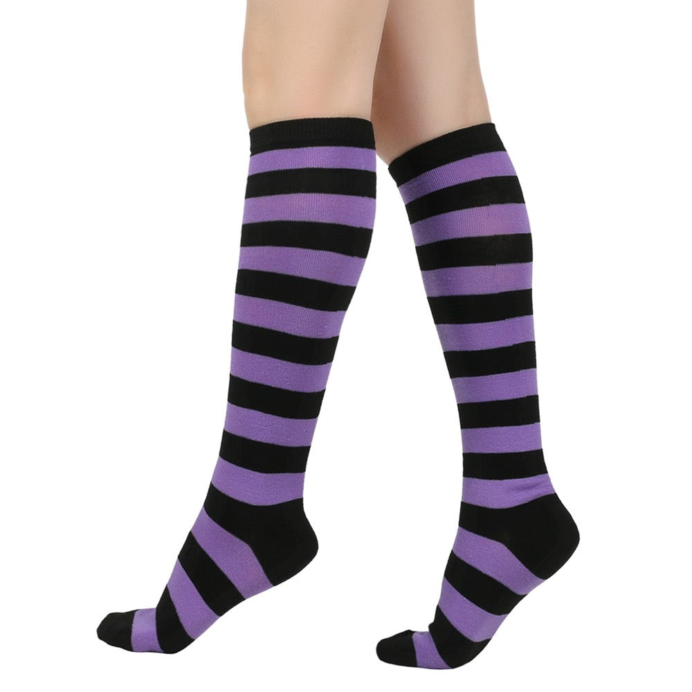 Purple and black femboy striped knee-high socks on a white background