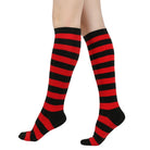 Black and red femboy striped knee-high socks on a white background