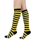 Black and yellow femboy striped knee-high socks on a white background