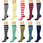 Set of colorful striped knee-high socks on a white background