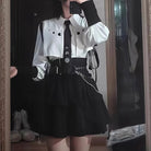 Gothic femboy in gothic white shirt and skirt set