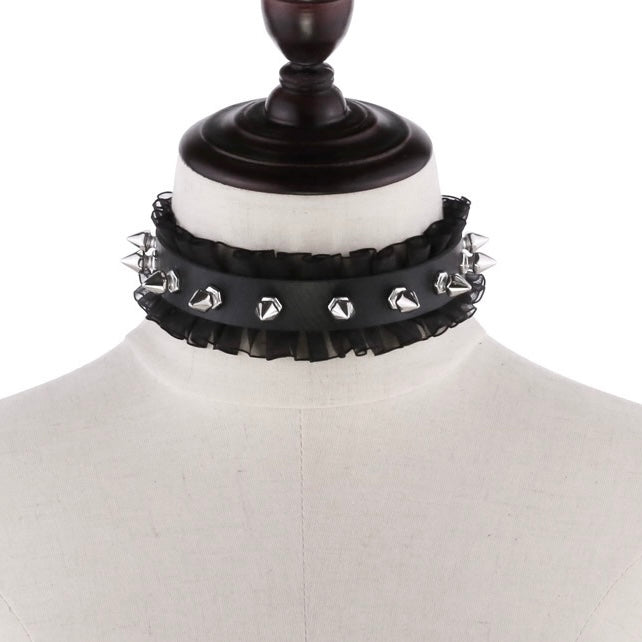 Black choker with studs on a mannequin head
