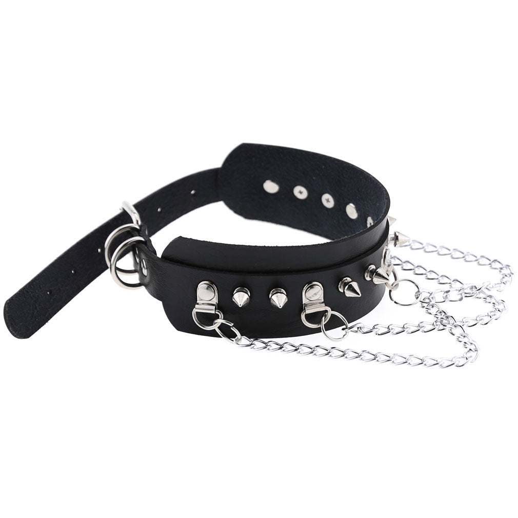 Black leather collar with silver chain and studs on a white background