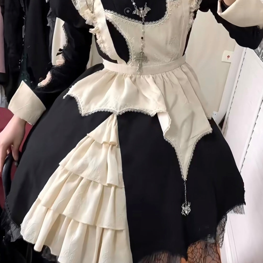 Gothic maid dress with ruffled details on a person.