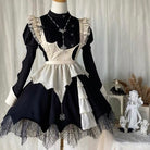 Gothic maid dress on a mannequin against a neutral background