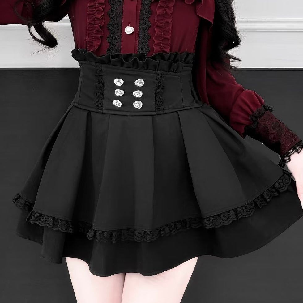 Black dress with ruffled details on a white background