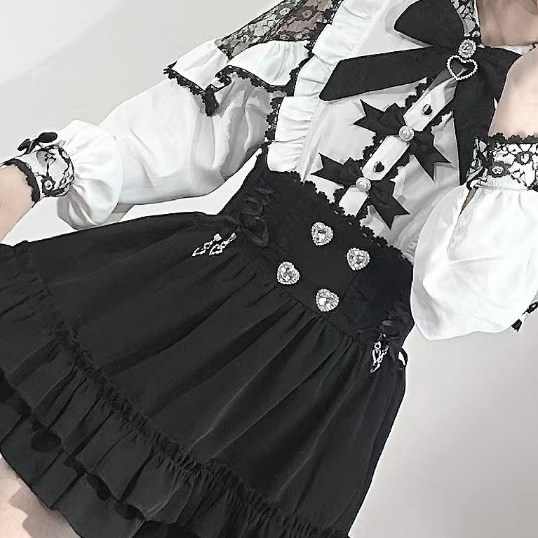 Black and white dress with lace details on a plain background