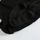 Low waisted black mini skirt detail