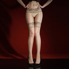 Person wearing lace-trimmed stockings against a dark background