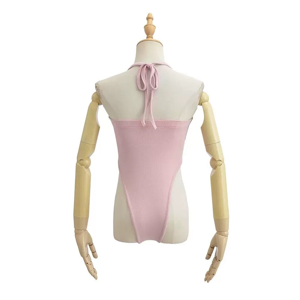 Mannequin wearing a pink and beige dress on a white background