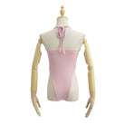 Mannequin wearing a pink and beige dress on a white background
