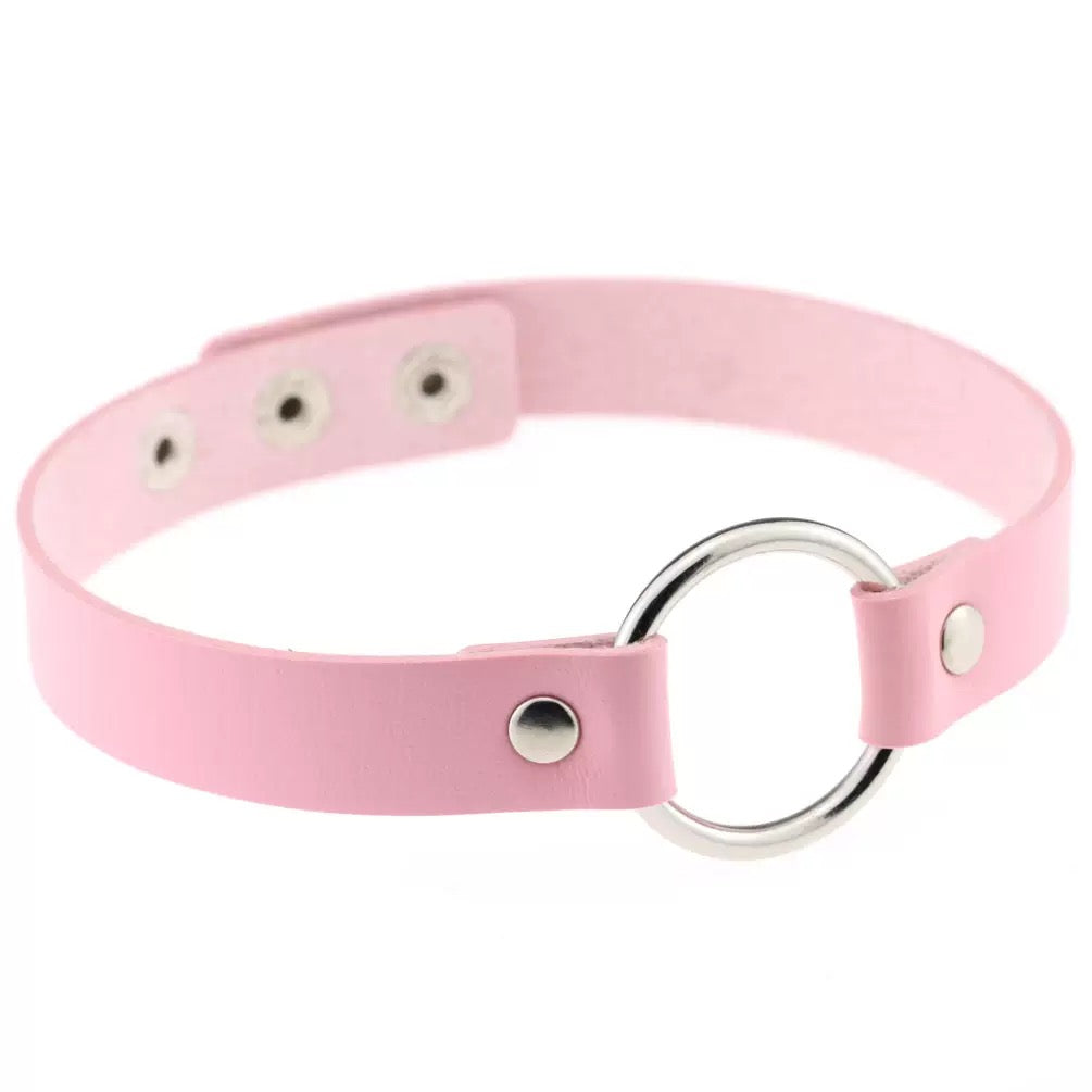 Pink leather o-ring choker on a white background