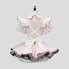 Pink and white dress on a mannequin against a light gray background