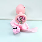 Pink silicone butt plug with bells