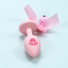 Pink silicone cat paw butt plug with bell