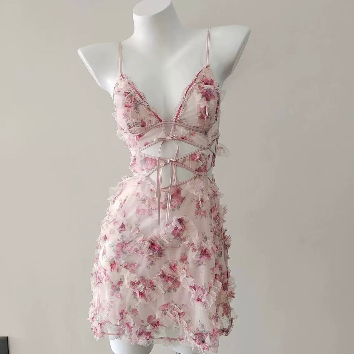 Floral sweet lace camisole nightgown on a mannequin against a plain background