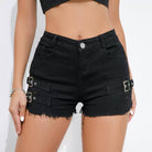 Black denim shorts with metal buckles worn by a person on a white background