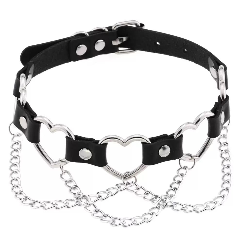 Black leather choker with silver chain and heart designs on a white background