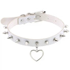 White leather choker with silver spikes and a heart pendant on a white background