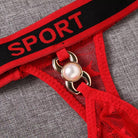 Red lace lingerie with a gold clasp and 'SPORT' waistband on a gray background