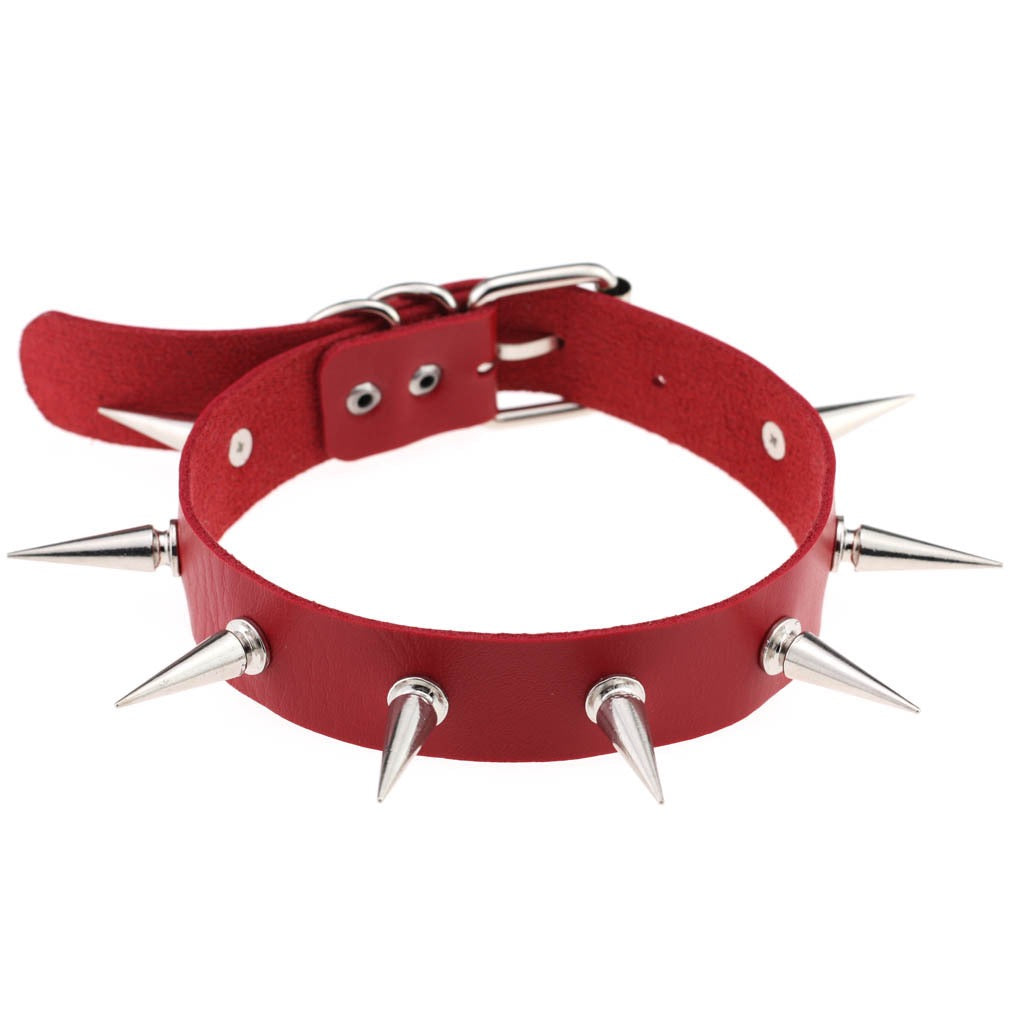 Red leather choker with silver spikes on a white background