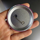 Round femboy pride flag pin back detilas